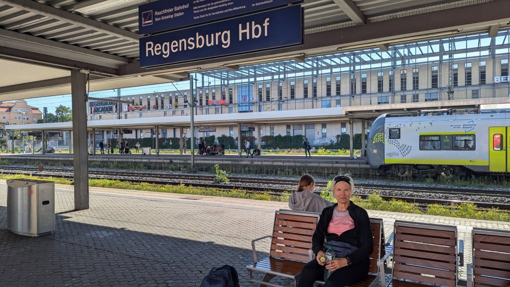 Kelly waiting in train station.