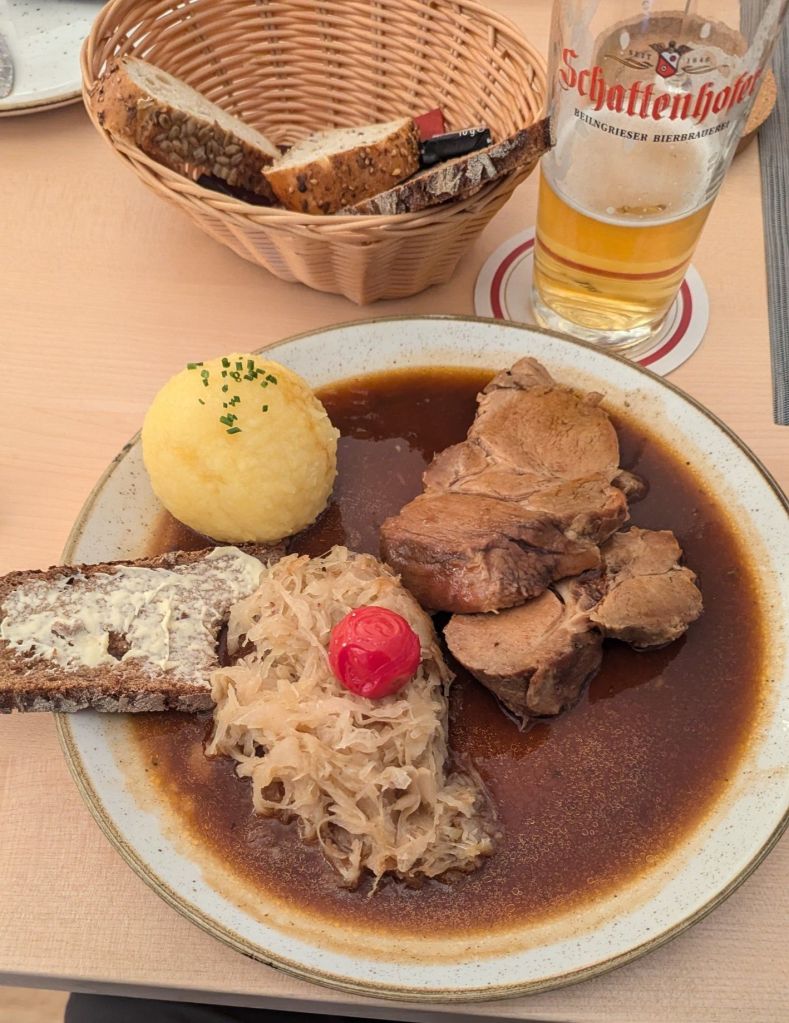 It doesn't get much more German than pork, sauerkraut and potato dumplings.