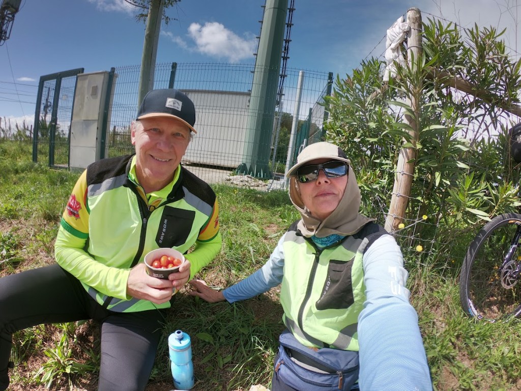 two cyclists in long sleeves