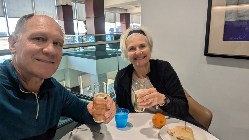 Drinking wine in airport lounge