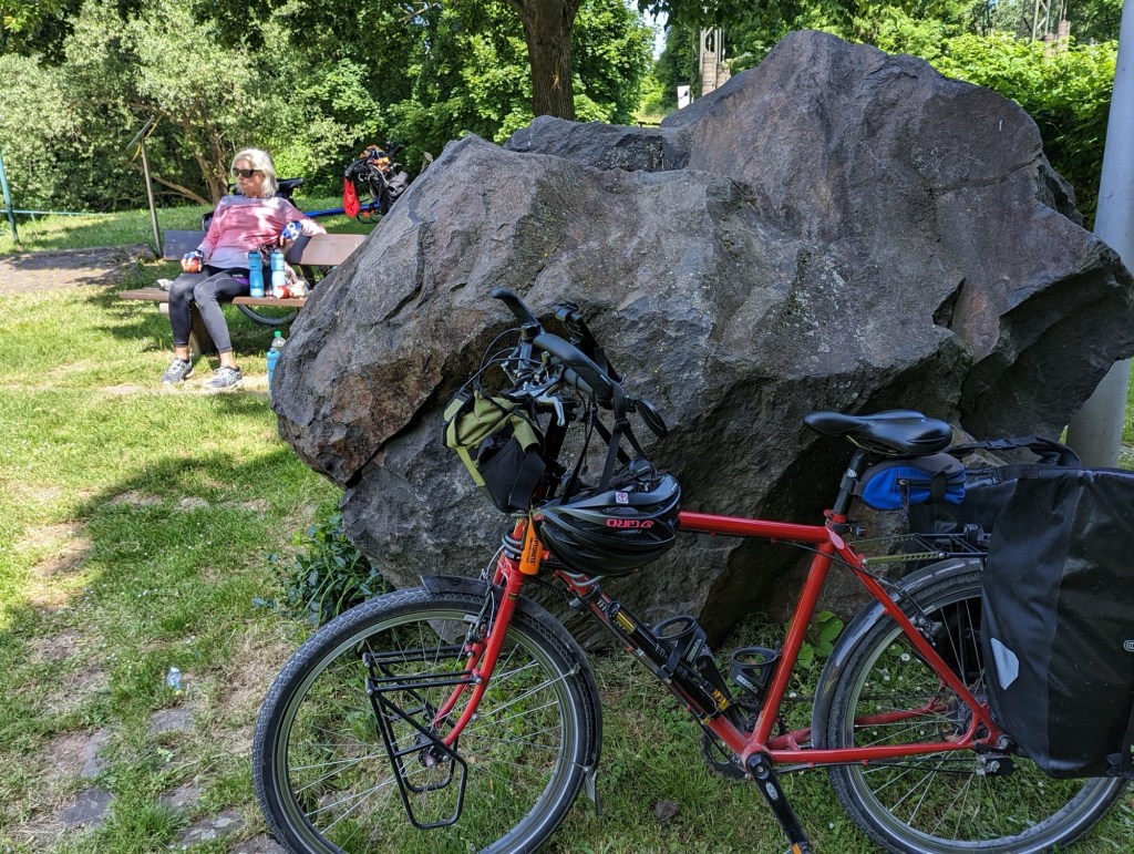 Bikes parked by large rock